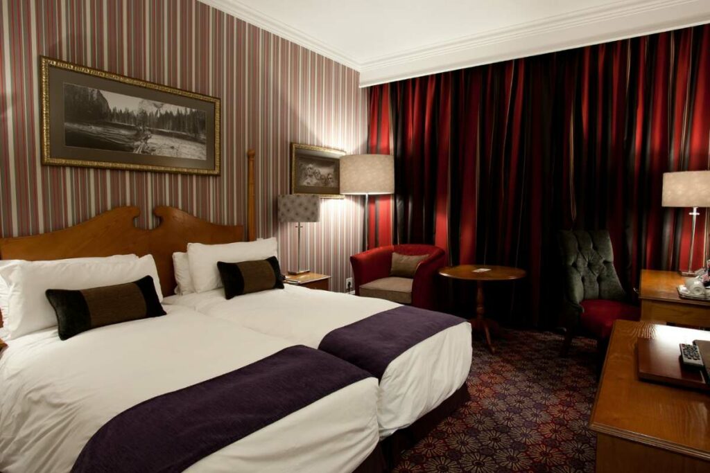 Classic Twin Room bedroom at Walmont Hotel at Graceland, Secunda