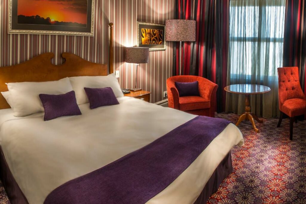 Deluxe King Room bedroom at Walmont Hotel at Graceland, Secunda