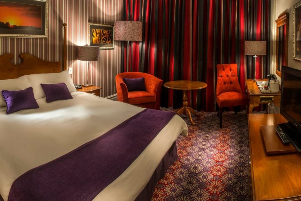 Deluxe King Room bedroom right view at Walmont Hotel at Graceland, Secunda