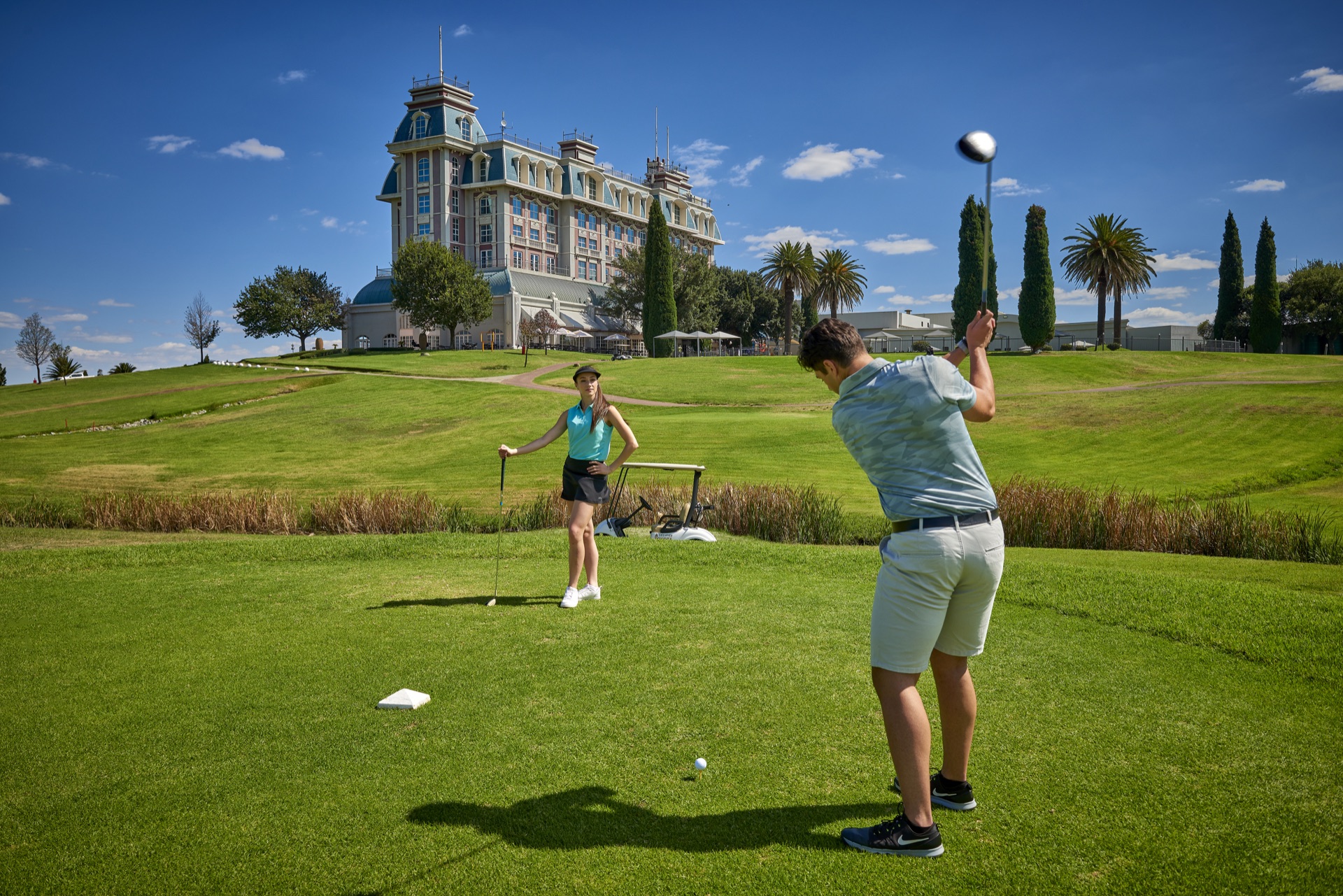 Golfers teeing off on the course at Graceland Hotel Casino and Country Club